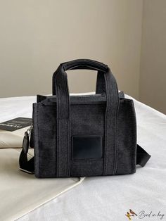 BirdinBag - Spacious Denim Tote Bag Ideal for Stylish Commuters Black Denim Travel Bag, Black Denim Travel Shoulder Bag, Casual Denim Bag With Top Carry Handle, Casual Black Denim Shoulder Bag, Casual Black Denim Bag, Black Denim Bags For Daily Use, Black Denim Tote Shoulder Bag, Black Denim Shoulder Bag For Everyday Use, Black Trendy Denim Bag