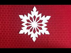 a white snowflake on a red background