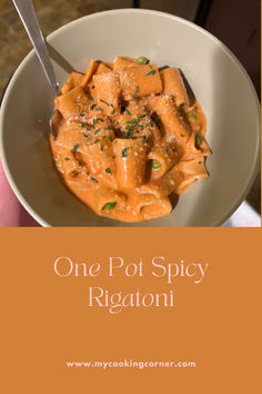 a person holding a bowl of food with the words one pot spicy rigatoni