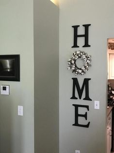 there is a sign that says home on the wall