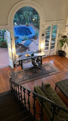 a living room filled with furniture and a pool