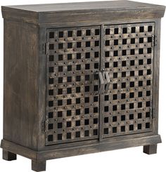 an old wooden cabinet with lattice design