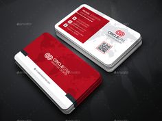 a red and white business card on a black surface with a world map in the background