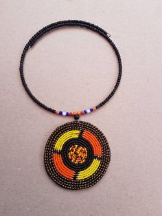 This listing is for ALL 5 beaded necklaces shown above. These necklaces are 100% handmade using fine beads. They come in different colors. Buy multiple items and pay shipping for ONE item ONLY. They ship through DHL Express. More neckleces here; https://www.etsy.com/shop/TribalTess?ref=seller-platform-mcnav&section_id=21306083 Back to my shop; https://www.etsy.com/shop/TribalTess?ref=seller-platform-mcnav Orange Oval Beaded Necklaces As Gifts, Orange Oval Beaded Necklace For Gifting, Orange Oval Beaded Necklace For Gift, Polished Bead Pendant Necklace, Brown Beaded Round Pendant Necklace, Brown Beaded Necklaces With Black Beads For Gift, Brown Beaded Necklace With Black Beads For Gift, Brown Beaded Necklace With Black Beads As Gift, Gift Pendant Beaded Necklaces With Large Beads