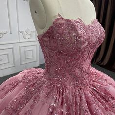 Embrace the romance and elegance of this Romantic Court Train Ball Gown. This dress is crafted from delicate pink tulle and features a stunning ball gown silhouette that flows gracefully into a beautiful court train, adding just the right amount of drama and sophistication. The strapless neckline perfectly frames the shoulders and neckline, giving you a timeless, feminine look. The appliqued detailing and subtle sequins on the bodice add a touch of sparkle and elegance, enhancing the dress’s bea Dark Pink Quinceanera Dresses, Organza Sleeves Style, Quinceanera Themes Dresses, 15 Dresses Quinceanera, Quinceanera Dresses Pink, White Homecoming Dresses, Cathedral Train, Organza Sleeves, Blue Homecoming Dresses