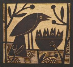 a wood block with a bird and flowers in the background, on a wooden surface