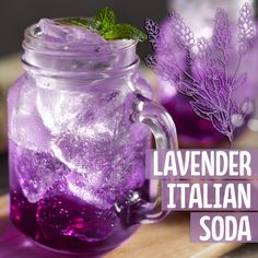 lavender italian soda in a mason jar with ice and sprigs on the side