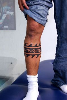 a man with a tattoo on his leg