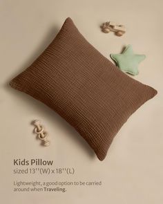 a brown pillow sitting on top of a white table