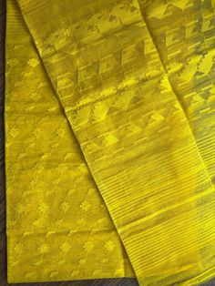 Pure Authentic Handloom Dhakai Jamdani Saree in yellow color Elevate your style with this Premium Quality Handwoven Dhakai Jamdani Saree. Handwoven with intricate detailing of needle jamdani work in Yellow thread, body in Yellow.  It offers a comfortable and luxurious feel along with the elegant and traditional look. Material: Halfsilk with Rice starch Type: Handloom Saree Design: Handwoven Jamdani Saree Length: 5. 5 meters Blouse: Not Included Care: Dry Wash Only Condition: New Care : Dry Clean Semi-stitched Yellow Tussar Silk Traditional Wear, Semi-stitched Yellow Handloom Traditional Wear, Yellow Unstitched Traditional Wear With Chikankari Embroidery, Yellow Slub Silk Traditional Wear With Self Design, Yellow Traditional Wear With Chikankari Embroidery For Puja, Yellow Handloom Saree For Wedding, Yellow Chikankari Embroidered Chanderi Traditional Wear, Yellow Chikankari Embroidered Traditional Wear For Festive Occasions, Yellow Cotton Silk Saree With Self Design