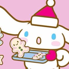 a hello kitty holding a tray with cookies and doughnuts in it's hands