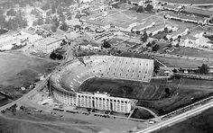 an aerial view of a stadium and surrounding buildings