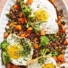 a white plate topped with an egg, broccoli and other foods on top of it