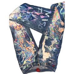 a pair of jeans with graffiti painted on them and the bottom part of the pants is rolled up