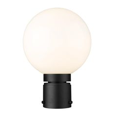 a light that is on top of a black stand with a white ball in the middle