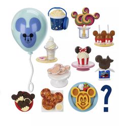 a bunch of toys that are in the shape of mickey mouse's head and other items