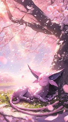 a pink dragon laying on the ground next to a tree with blossoming trees in the background