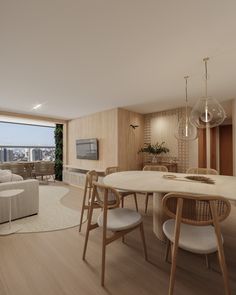 a living room and dining area in an apartment with wood floors, white furniture and large windows overlooking the city