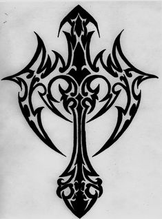 an ornate cross tattoo design on a white paper with some black ink in the middle