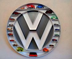 a white vw logo with cars on it and shelves in the shape of letters