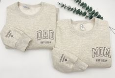 DAD Embroidered Sweatshirt or Hoodie, Name On Sleeve With Heart, Dada Crewneck, Fathers Day, Gift for Dad, Newly Dad, Daddy Est Year Shirt The item shown in the first picture features Dark Grey thread on an oatmeal heather sweatshirt. 💕WELCOME TO Love Stitches Co If you are looking for soft, comfy, first-rate sweatshirts, you're in the right place! Here at Love Stitches Co, we love what we do and strive to make your shopping experience just right for you. If you have any questions, concerns, or Casual Father's Day Gift Sweatshirt, Father's Day Crew Neck Sweatshirt As Gift, Dad Crewneck Sweatshirt, Matching Crew Neck T-shirt For Father's Day, Customizable Father's Day Crew Neck T-shirt, Dad Aesthetic, Mom Dad Baby, Dad Baby, Embroidered Crewneck