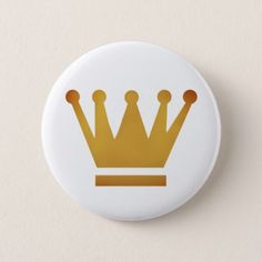 a white button with a gold crown on it