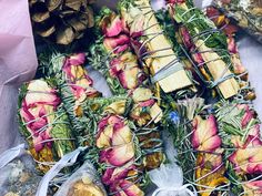 several bundles of dried flowers are wrapped in wire