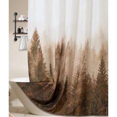 a bathroom with a shower curtain that has trees on it