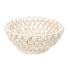 a white bowl with an intricate design in the center on a white background, it is made out of plastic