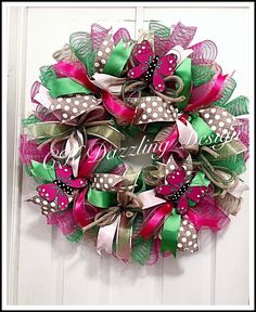 a pink and green wreath with polka dots