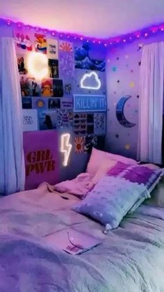 a bedroom with pink and purple lights on the ceiling