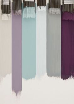 the paint brushes are all different shades of purple, blue, and grey in color