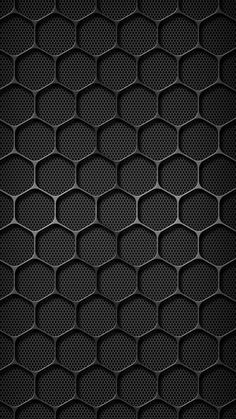 an abstract black background with hexagonal grids in the shape of honeycombs