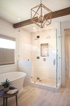 a bath room with a stand up shower and a tub