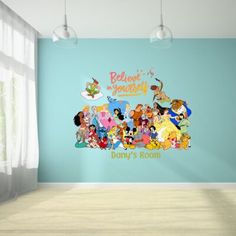 an empty room with blue walls and cartoon characters on the wall