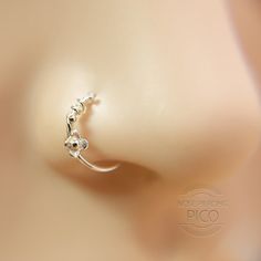 a close up view of a nose piercing