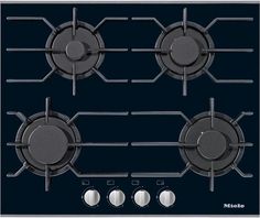 a black stove top with three burners and four knobs on the front side