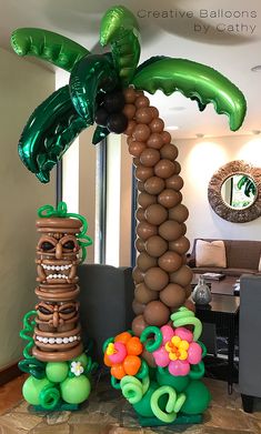 an inflatable palm tree and other decorations are on display