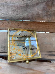 a small clock sitting on top of a wooden bench