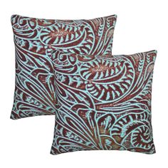 two blue and brown pillows on a white background, one with an intricate design in the middle