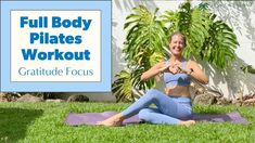 a woman is doing yoga outside in front of a sign that says full body pilates workout