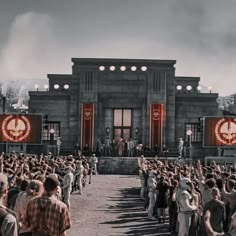 a large group of people standing in front of a building