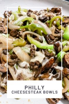 a white plate topped with cheesesteak bowls covered in mushrooms