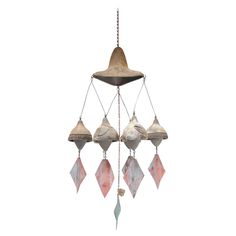 a wind chime hanging from the ceiling with several different shades of pink and white