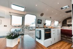 the interior of an rv is clean and ready to be used as a kitchen area