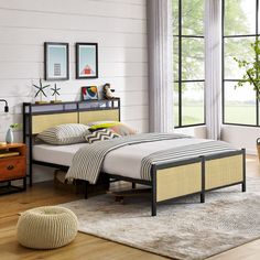 a bed room with a neatly made bed next to a window and a rug on the floor