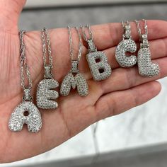 Looking for a stunning piece of jewelry that's both stylish and personalized? Look no further than our Iced Alphabet Crystal Pendant Necklace! Made with high-quality materials and sparkling crystals, this necklace is the perfect way to show off your unique style and personality. Material: 18K Gold Plated over Stainless Steel. Finished with anti-tarnish processing (allergic skin safe + nickel and lead-free). Does not tarnish. Bieber Hailey, Bubble Letter Necklace, Brass Chain Necklace, Initial Necklace Silver, Genuine Pearl Necklace, Bubble Letter, Monogram Pendant, Buy Necklace, Pearl Cream