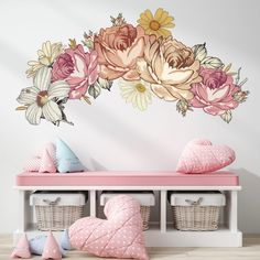 a wall decal with flowers on it in a child's room next to toys