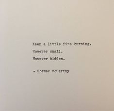 an old typewriter with the words'keep a little fire burning, flower smell, hover hidden '