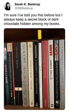 a book shelf filled with lots of books on top of each other and an orange marker sticking out of it